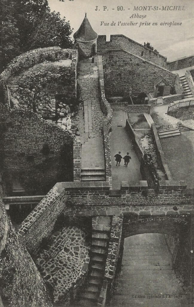 Postcard image of stone walkways, stairways, and parapets of Mt. St. Michel