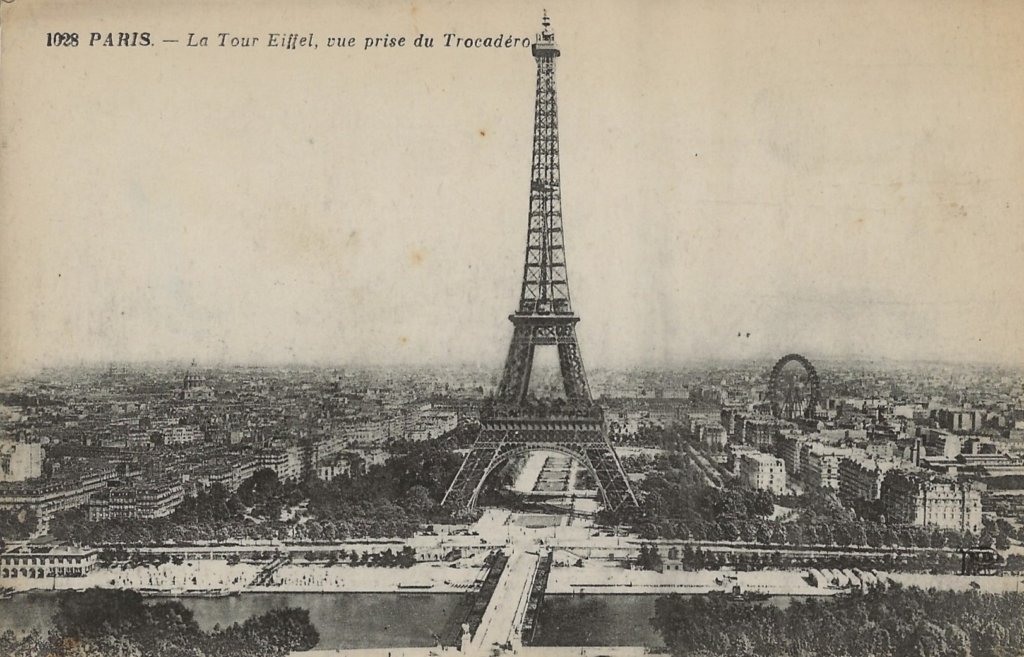 Postcard image of the Eiffel Tower, taken from across the Seine, with the Ferris Wheel in the background