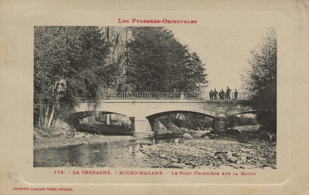 Postcard showing a low bridge over the river Raour, with a hand-marked X