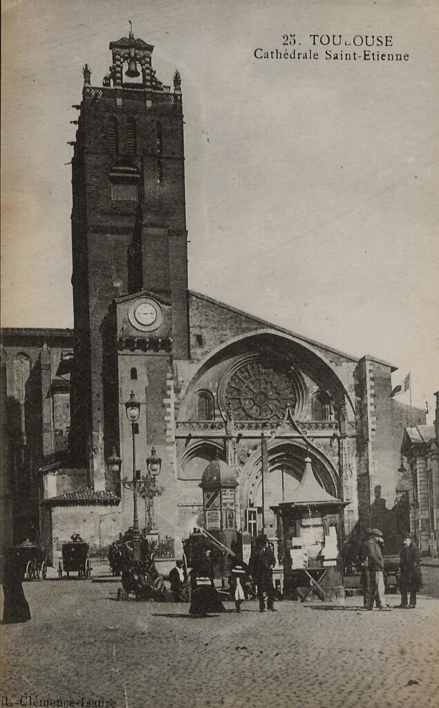 Postcard photo of St. Stephen's cathedral in Toulouse, with a Gothic facade and brick bell tower